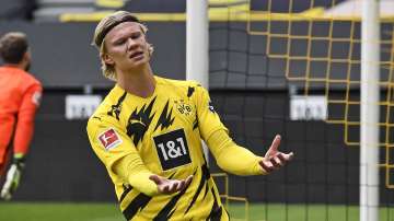 Dortmund's Erling Haaland reacts after missing a chance during the German Bundesliga soccer match between Borussia Dortmund and Eintracht Frankfurt in Dortmund, Germany, Saturday, April 3