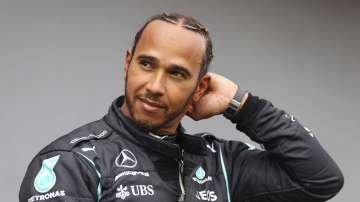 Mercedes driver Lewis Hamilton of Britain smiles after taking the fastest time during qualifying practice for Sunday's Emilia Romagna Formula One Grand Prix, at the Imola track, Italy, Saturday, April 17