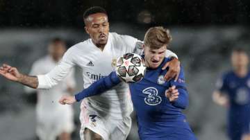 Chelsea's Timo Werner vies for the ball with Real Madrid's Eder Militao, left, during the Champions League semifinal first leg soccer match between Real Madrid and Chelsea at the Alfredo di Stefano stadium in Madrid, Spain, Tuesday, April 27