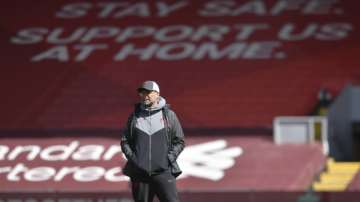 Liverpool's manager Jurgen Klopp stands ahead of he English Premier League soccer match between Liverpool and Newcastle United at Anfield stadium in Liverpool, England, Saturday, April 24