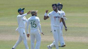 Bangladeshi bowler Ebadat Hossain, right, celebrates after dismissing Sri Lanka's Pathum Nisanaka during the fifth day of the first test cricket match between Sri Lanka and Bangladesh in Pallekele, Sri Lanka, Sunday, April 25