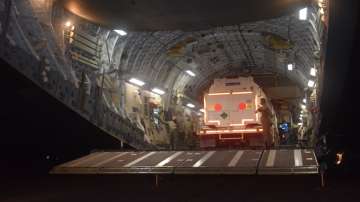 Indian Air Force aircraft lifts cryogenic oxygen containers from Air Force Station.