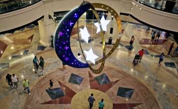 People walk inside a shopping mall with Ramadan decorations as they prepare for the holy month of Ra