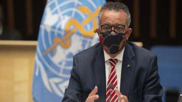 WHO Director-General, Dr Tedros Adhanom Ghebreyesus, wearing a mask to protect against coronavirus, gestures during a special session on the COVID-19 respnse.