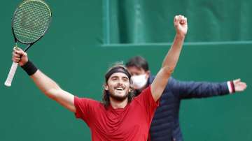 Stefanos Tsitsipas of Greece celebrates after defeating Andrey Rublev of Russia during the Monte Carlo Tennis Masters tournament finals in Monaco, Sunday, April 18