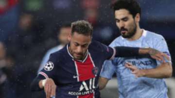 Manchester City's Ilkay Gundogan, right, challenges PSG's Neymar during the Champions League semifinal first leg soccer match between Paris Saint Germain and Manchester City at the Parc des Princes stadium, in Paris, France , Wednesday, April 28