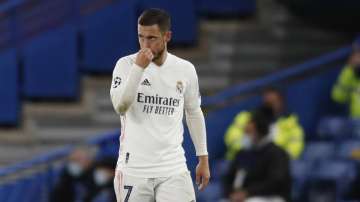 Real Madrid's Eden Hazard gestures after Chelsea's Mason Mount scored his side's second goal, during the Champions League semifinal 2nd leg soccer match between Chelsea and Real Madrid at Stamford Bridge in London, Wednesday, May 5