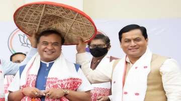 Bharatiya Janata Party (BJP) leader Himanta Biswa Sarma who is set to be the next chief minister of Assam is greeted by outgoing chief minister Sarbananda Sonowal, right in Guwahati.