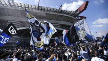 Inter Milan's supporters celebrate their team's Serie A title prior to the Serie A soccer match between Inter and Udinese, at the San Siro stadium in Milan, Italy, Sunday, May 23