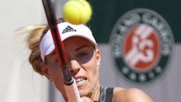 Germany's Angelique Kerber returns the ball to Ukraine's Anhelina Kalinina during their first round match of the French Open tennis tournament at the Roland Garros stadium Sunday, May 30