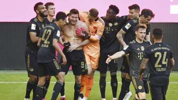 Bayern's Robert Lewandowski, fourth from left, celebrates with his teammates after scoring his side's fifth goal during the Bundesliga soccer match between Bayern Munich and FC Augsburg at the Allianz Arena stadium in Munich, Germany, Saturday, May 22