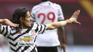 Manchester United's Edinson Cavani celebrates after scoring his side's third goal during the English Premier League soccer match between Aston Villa and Manchester United at Villa Park in Birmingham, England, Sunday, May 9