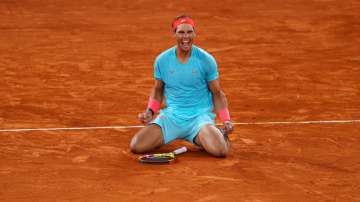 Rafael Nadal of Spain celebrates after winning championship point during his Men's Singles Final against Novak Djokovic of Serbia on day fifteen of the 2020 French Open at Roland Garros on October 11, 2020 in Paris