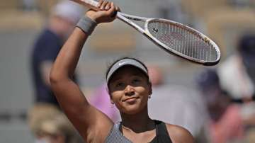 Japan's Naomi Osaka celebrates after defeating Romania's Patricia Maria Tig during their first round match of the French open tennis tournament at the Roland Garros stadium Sunday, May 30