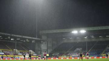 Heavy rain falls during the English Premier League soccer match between Burnley and West Ham United and at Turf Moor stadium in Burnley, England, Monday, May 3