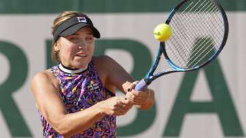 United States's Sofia Kenin plays a return to Ukraine's Elina Ostapenko during their first round match on day two of the French Open tennis tournament at Roland Garros in Paris, France, Monday, May 31