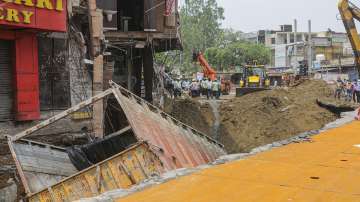 cyclone tauktae, Truck, fall, caved road, heavy rainfall, Delhi, aftermath, metro station, national 