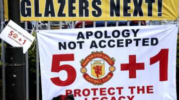 Banners near the stadium as fans protest against the Glazer family, owners of Manchester United, before their Premier League match against Liverpool at Old Trafford, Manchester, England, Sunday, May 2