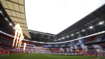 The teams enter the field for the FA Cup final soccer match between Chelsea and Leicester City at Wembley Stadium in London, England, Saturday, May 15