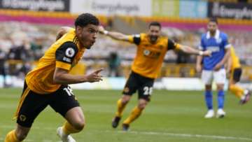 Wolverhampton Wanderers' Morgan Gibbs-White, left, celebrates after scoring his side's second goal during the English Premier League soccer match between Wolverhampton Wanderers and Brighton & Hove Albion at the Molineux Stadium in Wolverhampton, England, Sunday, May 9