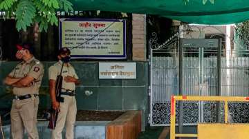 Police personnels stand guard at the residence of Anil Deshmukh in him.