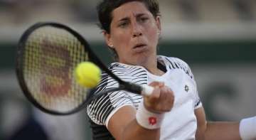 Spain's Carla Suarez Navarro plays a return to United States's Sloane Stephens during their first round match on day three of the French Open tennis tournament at Roland Garros in Paris, France, Tuesday, June 1