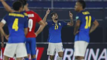 Brazil's Lucas Paqueta, center, celebrates after scoring his side's 2nd goal against Paraguay during a qualifying soccer match for the FIFA World Cup Qatar 2022 at Defensores del Chaco stadium in Asuncion, Paraguay, Tuesday, June 8