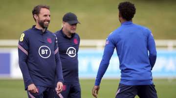 England manager Gareth Southgate, left, and Marcus Rashford during a training session at St George's Park, Burton upon Trent, England, Monday June 14