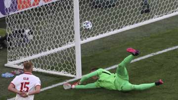Poland's goalkeeper Wojciech Szczesny scores an own goal during the Euro 2020 soccer championship group E match between Poland and Slovakia at Gazprom arena stadium in St. Petersburg, Russia, Monday, June 14