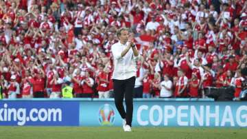 Denmark's managaer Kasper Hjulmand applauds fans as he walks off the field after the Euro 2020 soccer championship group B match between Denmark and Belgium, at the Parken stadium in Copenhagen, Thursday, June 17