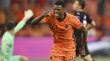 Denzel Dumfries of the Netherlands celebrates after scoring his side's second goal during the Euro 2020 soccer championship group C match between the The Netherlands and Austria at Johan Cruijff ArenA in Amsterdam, Netherlands, Thursday, June 17