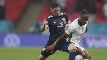 Scotland's Billy Gilmour, left, and England's Phil Foden vie for the ball during the Euro 2020 soccer championship group D match between England and Scotland at Wembley stadium in London, Friday, June 18