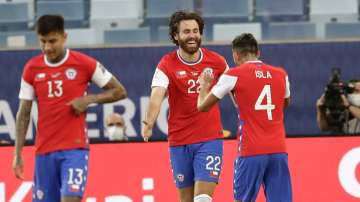 Chile's Ben Brereton, center, celebrates scoring his side's opening goal against Bolivia during a Copa America soccer match at Arena Pantanal stadium in Cuiaba, Brazil, Friday, June 18