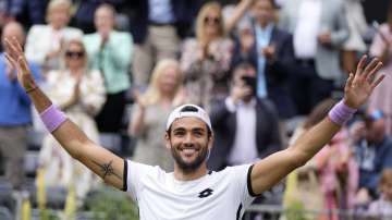 Matteo Berrettini of Italy celebrates winning against Cameron Norrie of Britain after their final singles tennis match at the Queen's Club tournament in London, Sunday, June 20