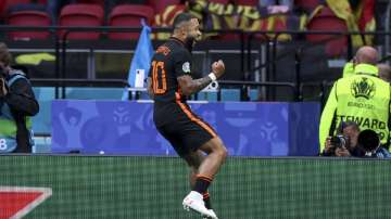 Memphis Depay of the Netherlands celebrates after scoring his side's opening goal during the Euro 2020 soccer championship group F match between North Macedonia and Netherlands, at the Johan Cruyff ArenA in Amsterdam, Netherlands, Monday, June 21