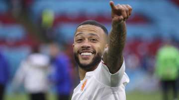 Memphis Depay of the Netherlands celebrates his side's 3-0 win, at the end of the Euro 2020 soccer championship group F match between North Macedonia and Netherlands, at the Johan Cruyff ArenA in Amsterdam, Netherlands, Monday, June 21