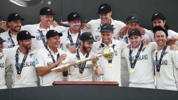 New Zealand players celebrate with the winners trophy after their win in the World Test Championship
