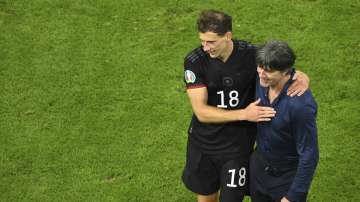 Germany's manager Joachim Loew greets Germany's Leon Goretzka after the Euro 2020 soccer championship group F match between Germany and Hungary at the football arena stadium in Munich, Germany, Wednesday, June 23