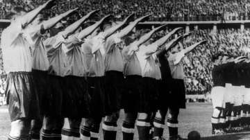 In this May 14, 1938 file photo the England soccer team give the Nazi salute before the start of their game against Germany in front of a record crowd of over 100,000 at the Olympic Stadium in Berlin.