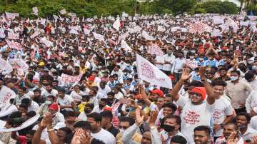 Navi Mumbai: Locals gather at Palm Beach Road near CBD Belapur as they protest against the naming of Navi Mumbai International Airport, in Navi Mumbai, Thursday, June 24, 2021.