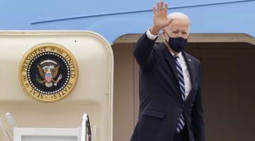 FILE - In this March 16, 2021, file photo, President Joe Biden waves from the top of the steps of Air Force One at Andrews Air Force Base, Md. On Biden’s first foreign trip as president
