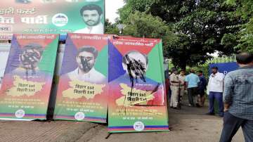 A view of the posters of rebel leaders of Lok Janshakti Party, painted black by Chirag Paswan supporters, outside party office in Patna