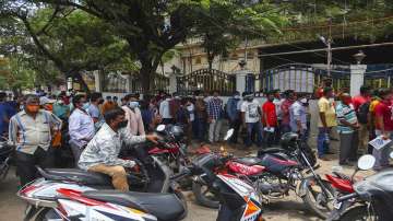 People queue up to get inoculated against the coronavirus during a special vaccination drive held for those working in various markets in Hyderabad.