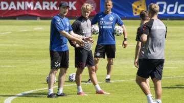 Danish head coach Kasper Hjulmand, left, attends a soccer team training session on Friday June 4