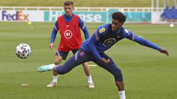 England's Marcus Rashford stretches for a ball during the training session at St George's Park, Burton upon Trent, England on Thursday June 10