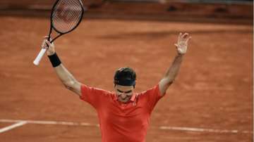 Switzerland's Roger Federer celebrates after defeating Germany's Dominik Koepfer in their third round match on day 7, of the French Open tennis tournament at Roland Garros in Paris, France, Saturday, June 5