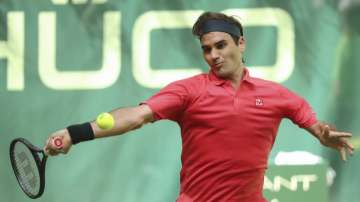 Switzerland's Roger Federer plays the ball during his ATP Tour Singles, Men, 1st Round match against Ilya Ivashka from Belarus in Halle, Germany, Monday, June 14