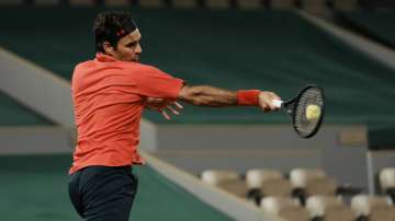 Switzerland's Roger Federer plays a return to Germany's Dominik Koepfer during their third round match on day 7, of the French Open tennis tournament at Roland Garros in Paris, France, Saturday, June 5