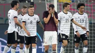 Latvia's Eduards Emsis, front, reacts during the international friendly soccer match between Germany and Latvia in Duesseldorf, Germany, Monday, June 7