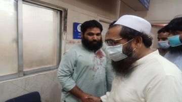 Hafeez Saeed's son Hafiz Talha caught in camera visiting a hospital after Lahore blast.